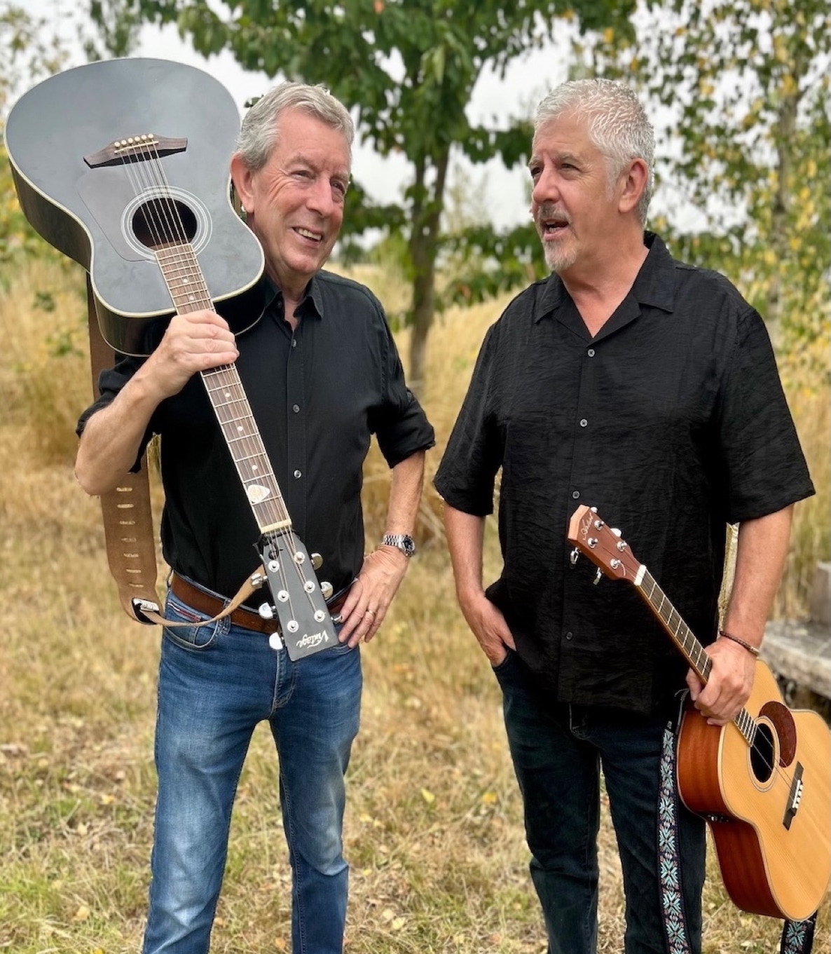 Clinton Rogers and John Hood with guitars at the ready for gigs across Somerset.